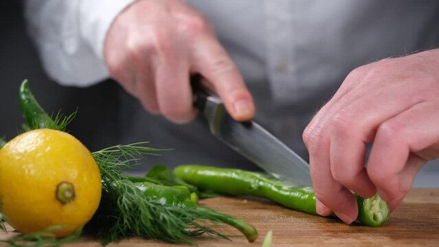 chopping chili peppers