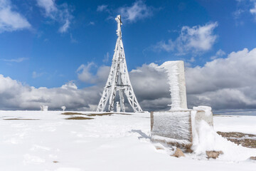 Cross on Mount Gorbea after the snowfall. Gorbea Natural Park