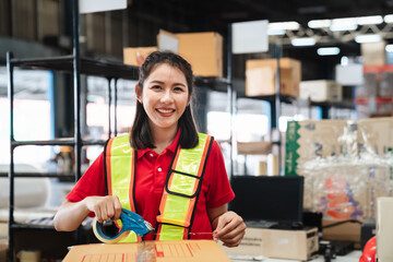 Warehouse worker checking and scanning a barcode on box package in the background warehouse.,...