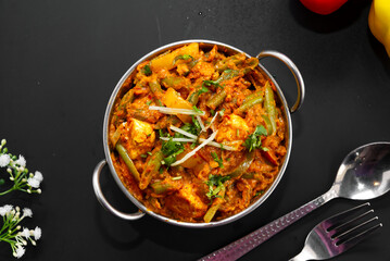 Vegetable Jalfrezi is packed with a multitude of vegetables, including bell peppers, carrots,...