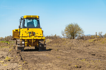 Obraz premium Preparation for construction. Heavy bulldozer standing on construction site.