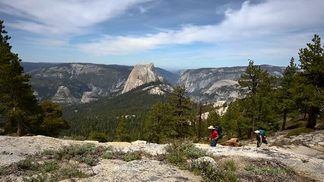 Two Backpackers Hiking Above Yosemite Valley in Yosemite National Park, California, USA