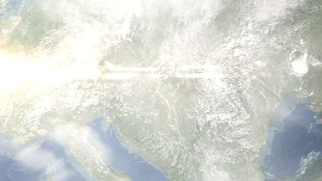 Earth zoom in from outer space to city. Zooming on Erd, Hungary. The animation continues by zoom out through clouds and atmosphere into space. Images from NASA