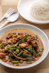 Stir fried pork belly and red curry paste with sting bean. Stir Fried Wild Boar with Red Curry