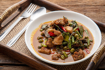 Stir fried pork belly and red curry paste with sting bean. Stir Fried Wild Boar with Red Curry