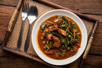 Stir fried pork belly and red curry paste with sting bean. Stir Fried Wild Boar with Red Curry