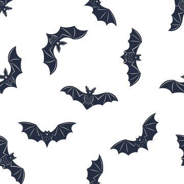Halloween seamless pattern. Vintage bat's silhouettes isolated on white background. Vector illustration