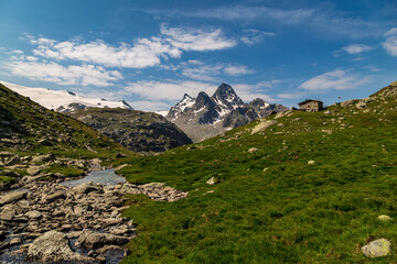 Naklejka na ściany i meble The beautiful mountains and lakes over La Thuile in a summer day