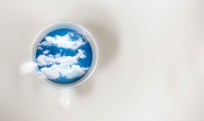 Coffee cup on top blue sky and cloud white background