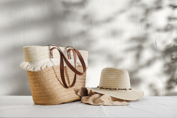 Summer bag on desk and wall with shadows. 