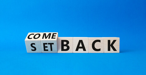 Comeback and setback symbol. Turned cubes with words setback and comeback. Beautiful blue...