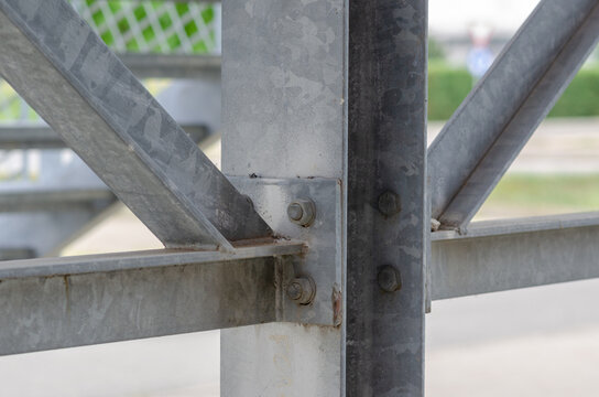 beam architecture: detail of a structure built with steel beams joined with bolting to support a staircase for emergency exits in a public building.