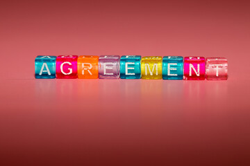 the word "agreement" made up of cubes