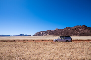 A 4x4 on a gravel road in Namibia Africa © Andreas