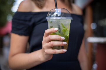 Fototapeta premium woman with cocktail in cafe
