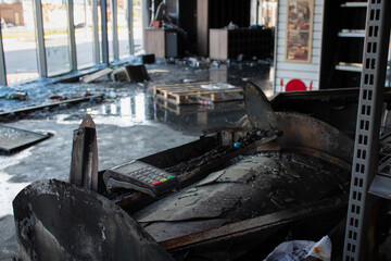 A bank terminal in a destroyed grocery supermarket. Russia's war against Ukraine.