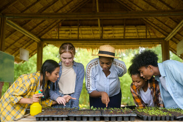 Group of mixed race students and teacher learning agriculture  technology in smart farming ,...