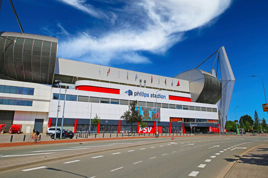 Eindhoven, Netherlands - July 17. 2022: Street view on modern Philips football stadium, blue summer sky