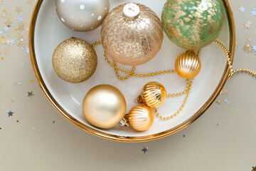 Mixed new year decorations in festive holiday dish