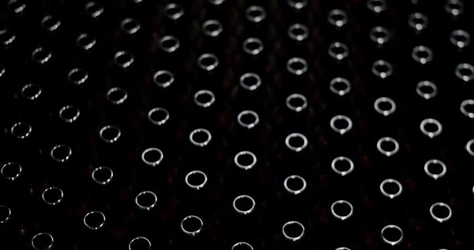 Close-up of brown bottles in a factory. A long row of glass bottles. Top view of a production line. Factory concept. Factory brewery concept.