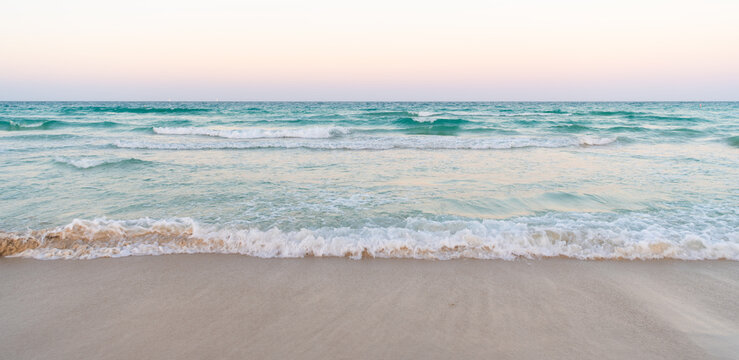 beautiful beach with sea water waves and morning sky