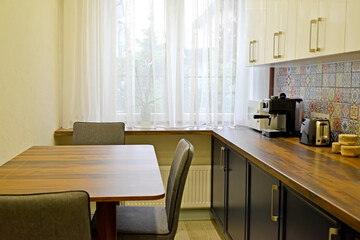 Dining table and appliances in the kitchen