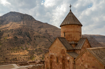 Surb Karapet or St. John the Baptist Church with mountains at the backgroundat Noravank Monastery Complex, Armenia