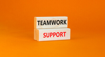 Teamwork support symbol. Concept words Teamwork support on wooden blocks on a beautiful orange table orange background. Business and teamwork support concept. Copy space.