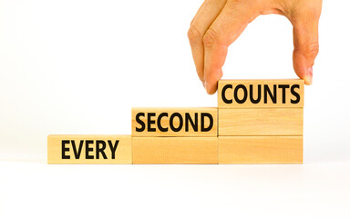 Every second counts symbol. Concept words Every second counts on wooden blocks on a beautiful white table white background. Businessman hand. Business, motivational and every second counts concept.