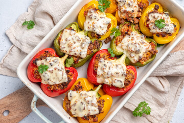 Colorful peppers stuffed with meat, bulgur and cheese