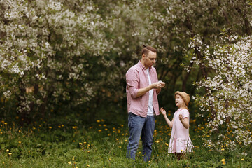 Fototapeta premium Father and little daughter are walking.