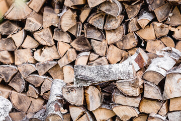 Heating season without gas. It's warm in the house. A stack of firewood for heating the house. The...