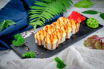 Sushi rolls with cheese cap, cream cheese, iceberg lettuce and chicken. Traditional Japanese cuisine