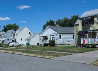 American suburban residential street with modest clapboard houses