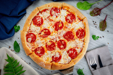 Pepperoni pizza on a shovel. Freshly baked with sauce and mozzarella cheese