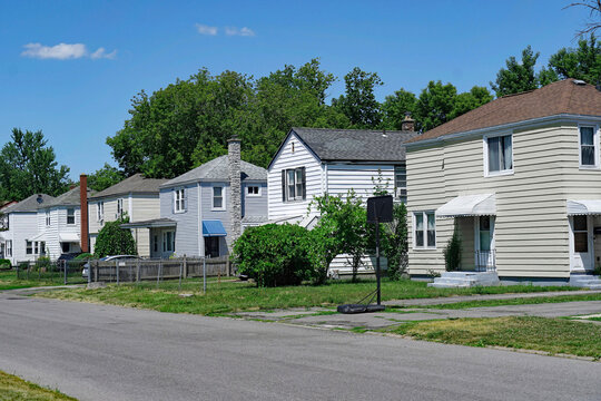 American suburban residential street with two story clapboard houses