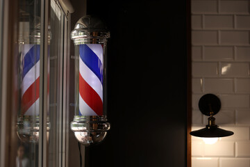 Barber shop vintage pole. copyspace Barbershop. Barber shop pole in red white and blue with...