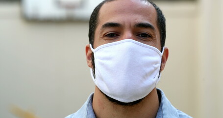 Man putting covid face mask prevention