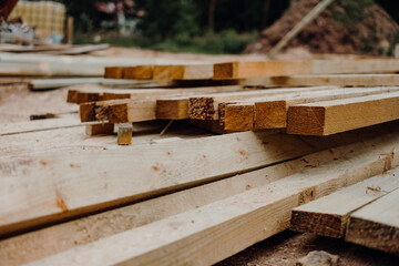 Wood modern and classic tools on newly building house construction with new roof structure , water pipes and scaffolding around building