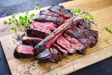 Modern style traditional barbecue dry aged wagyu porterhouse beef steak bistecca alla Fiorentina...