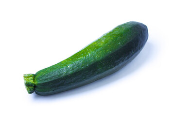 green zucchini lies on a white background