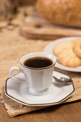 table with coffee cup and butter cookies.