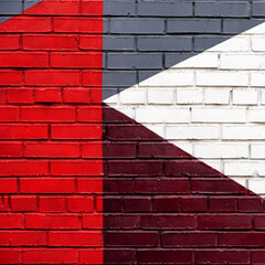 Abstract geometric pattern on brick wall, bright shades of colors