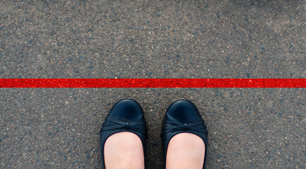 Red line on the road, someone is standing in front of the stop, having your own space, do not cross
