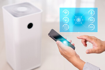 Smart home Ai technology on icon virtual screen concept,Man use smartphone control purifier online on application adjust and setting for smart home through the internet