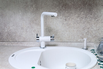 Modern kitchen sink and faucet and detergents