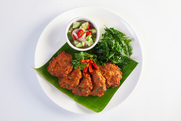 Thai Fish Cake Paste chili deep fried with herb and Crispy Thai Basil.