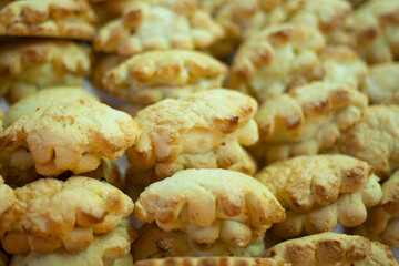 Sweet buns on counter. Homemade baking. Background delicious food. Golden crust on pie.