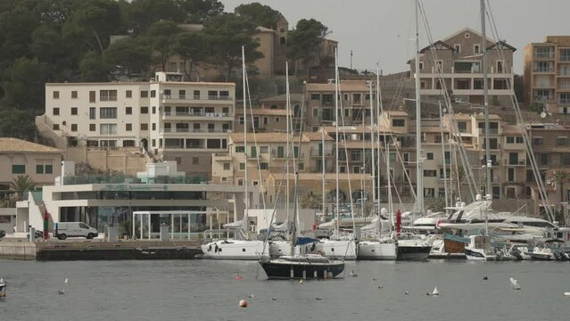 Harbour and pastel coloured houses towards Far de la Creu, Port de Soller, Majorca, Balearic Islands