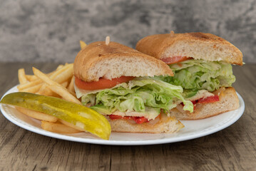 Loaded chicken breast sandwich with avocado and sliced tomato will ensure that the belly will be full